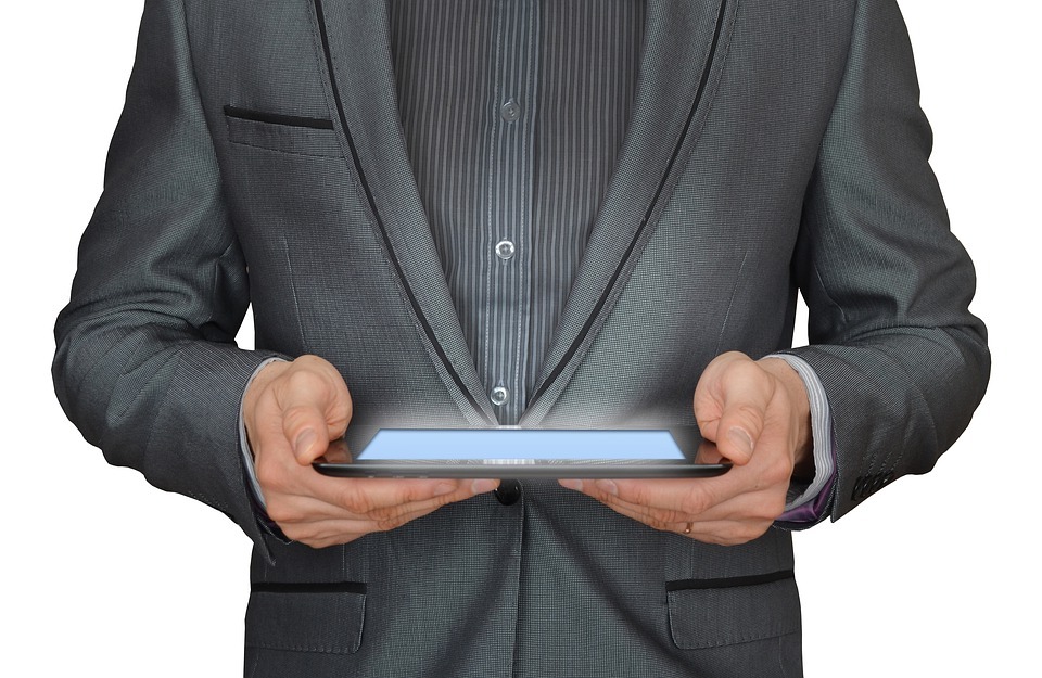 man holding tablet